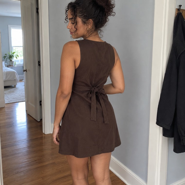 rear view of the matching waist bow in a home hallway.