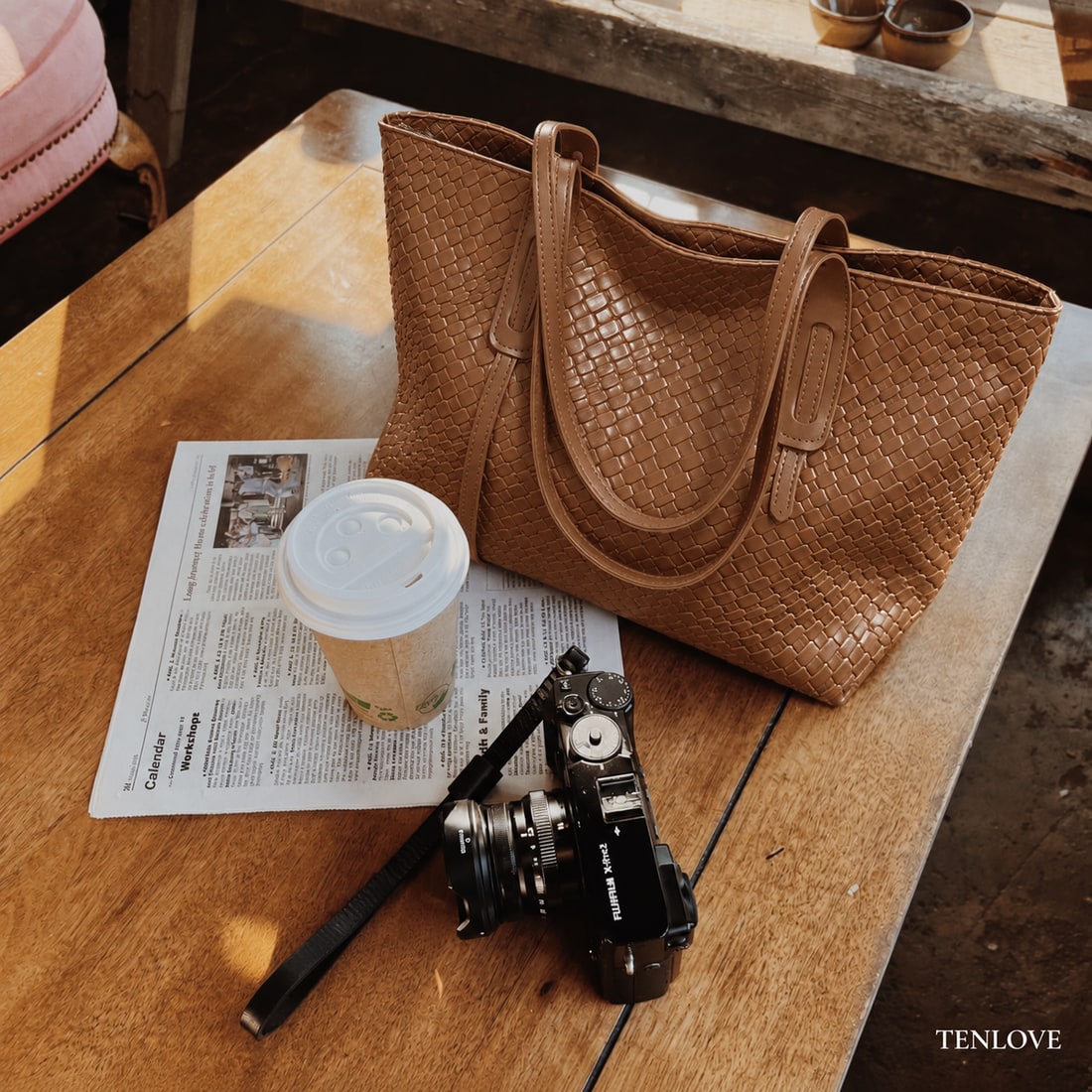 Brown woven PU tote on a cafe table