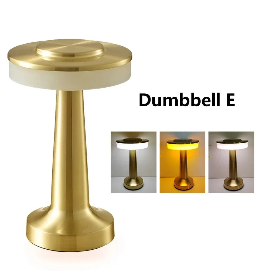 Product photograph of the gold C-style lamp.