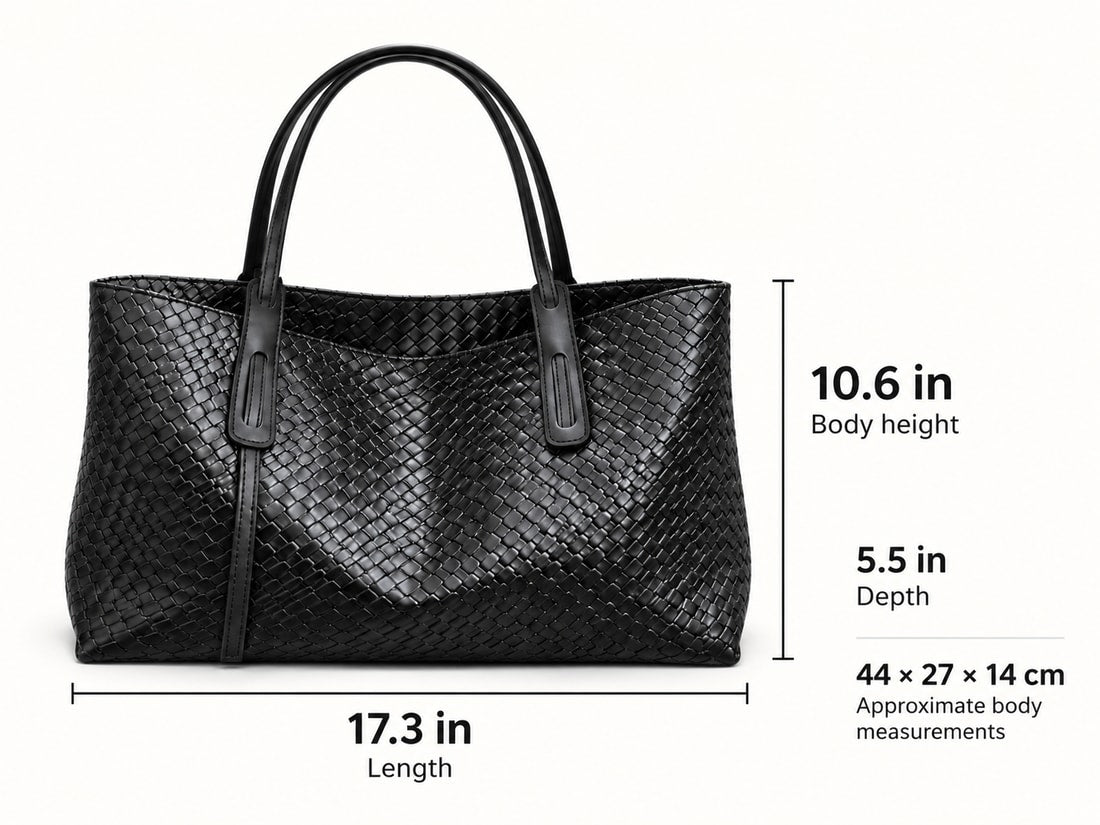 Black woven tote photograph with approximate body measurements: 17.3 inches long, 10.6 inches high excluding handles, and 5.5 inches deep.