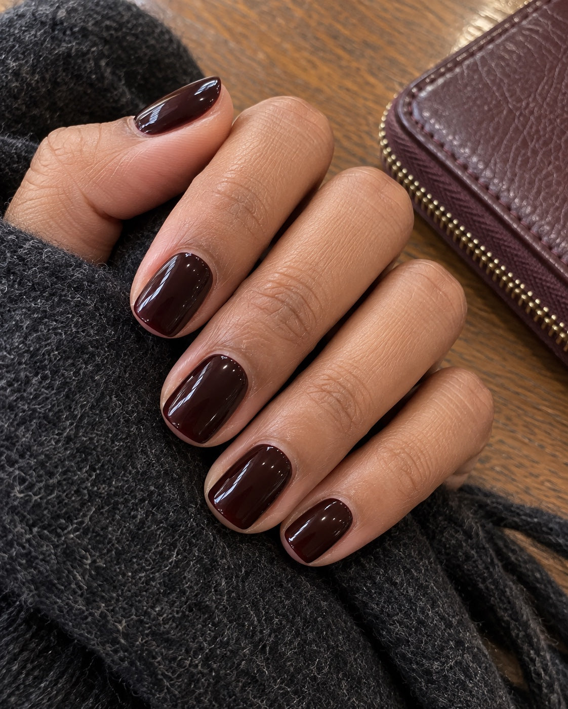 black cherry manicure worn on natural nails