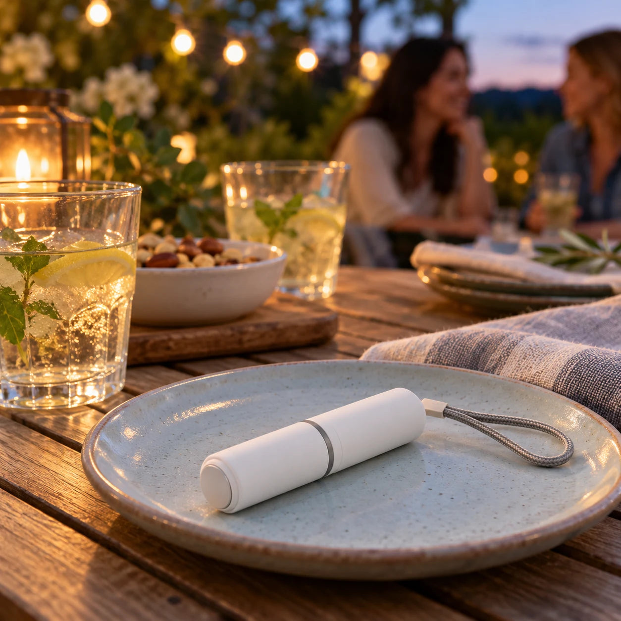 White mosquito bite pen on a garden table during a relaxed outdoor evening