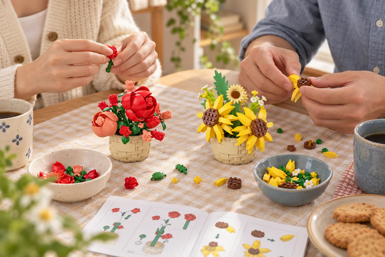 Two adults building miniature rose and sunflower kits together over coffee.