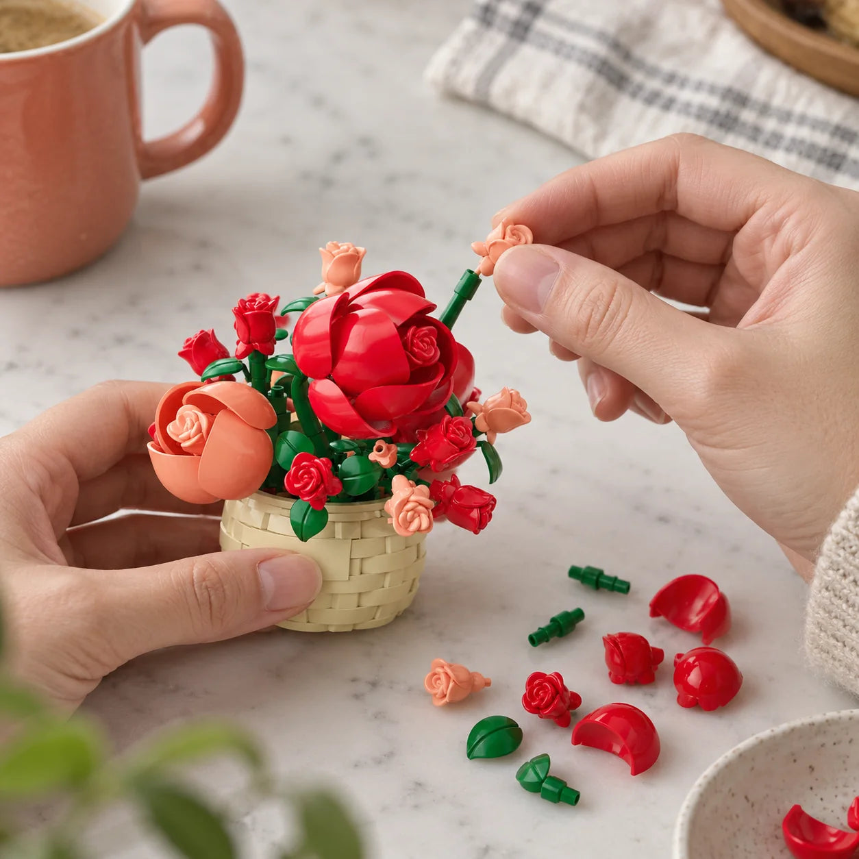 A tiny rose being built by hand.