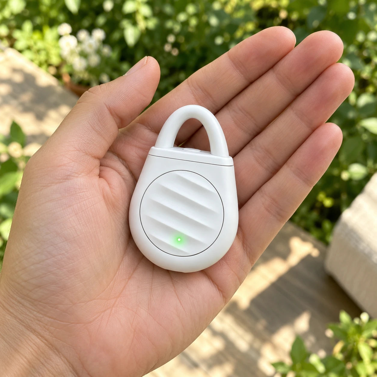 Pocket Outdoors Ultrasonic Device - in an adult hand for scale