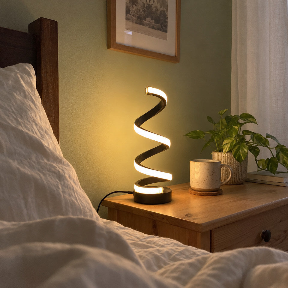 BLACK spiral lamp on a narrow pine nightstand in a modest bedroom.