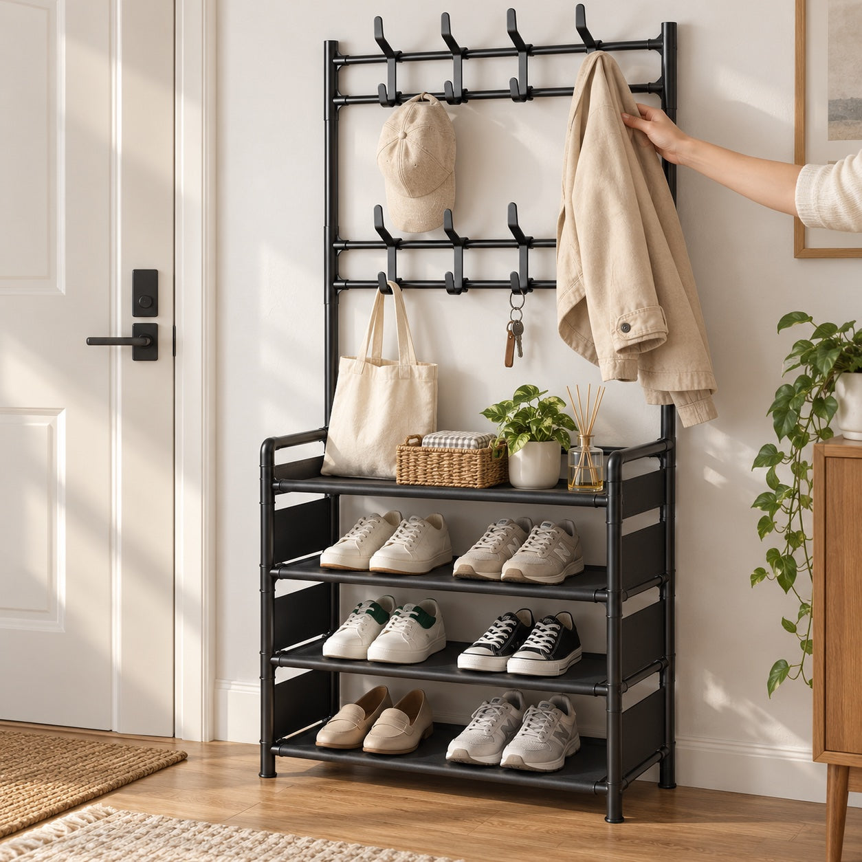 a hand reaching for a light jacket from the exact rack with daily shoes arranged below.