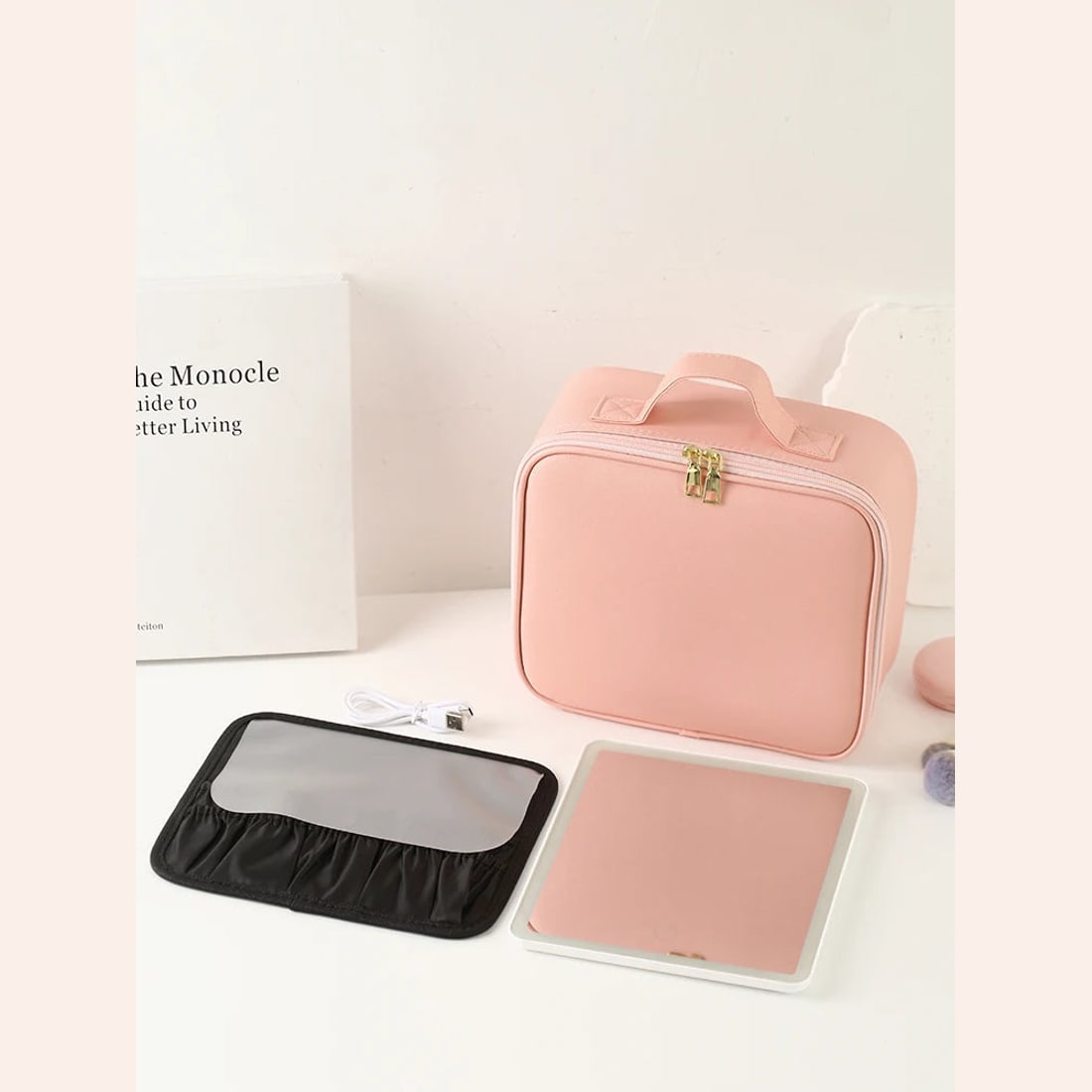 Photograph showing the case, detachable mirror, brush panel and cable.