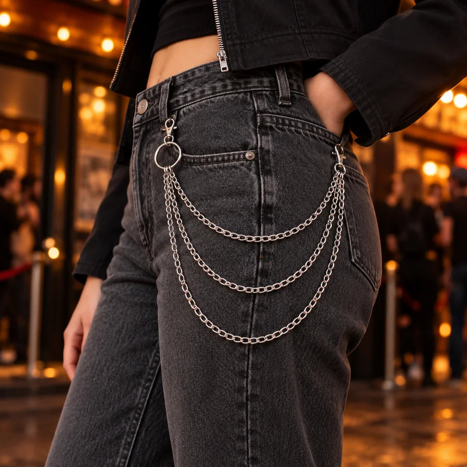 Adult at a music venue with triple-strand jeans chain
