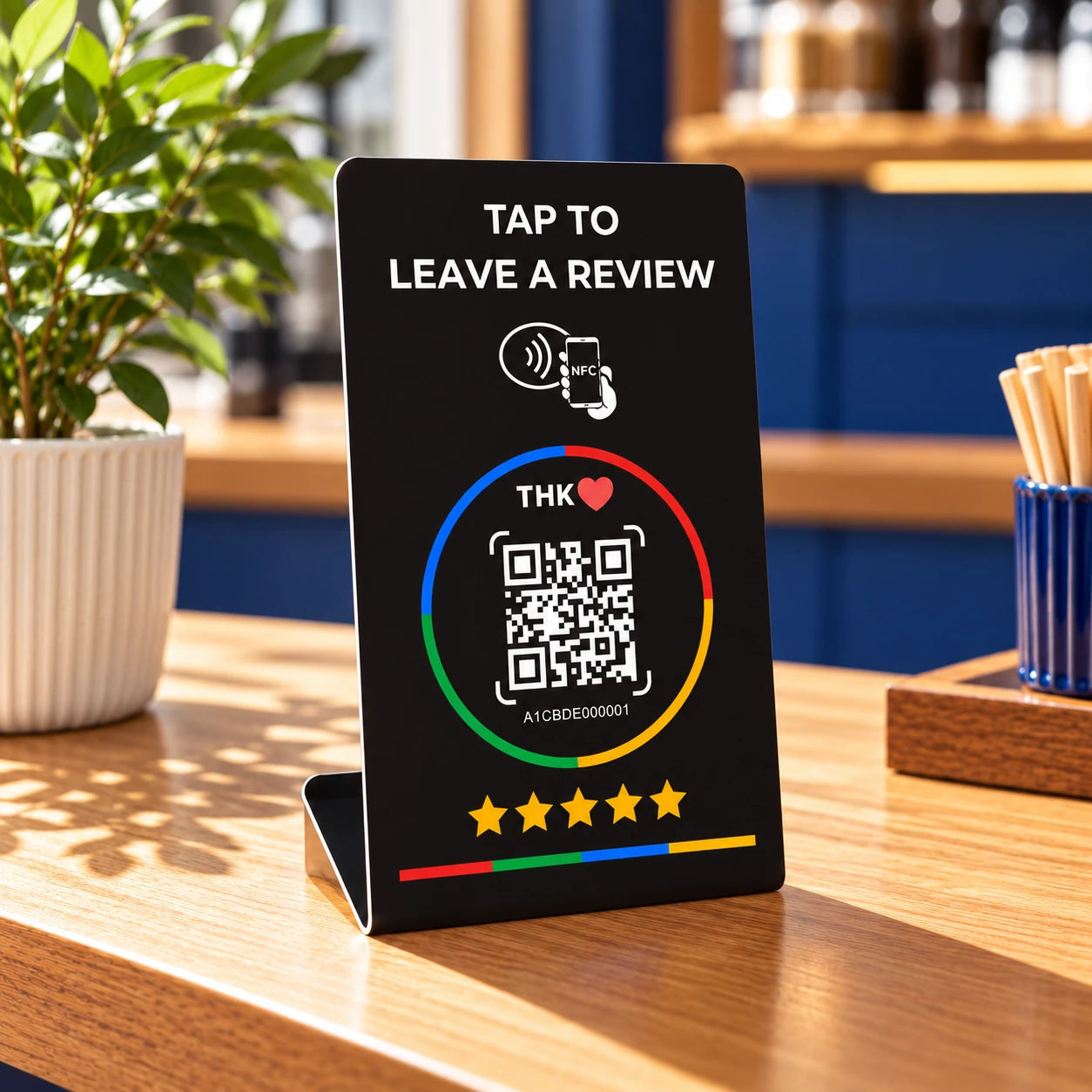 Close product photograph of Black Style A stand tap icon and QR artwork.