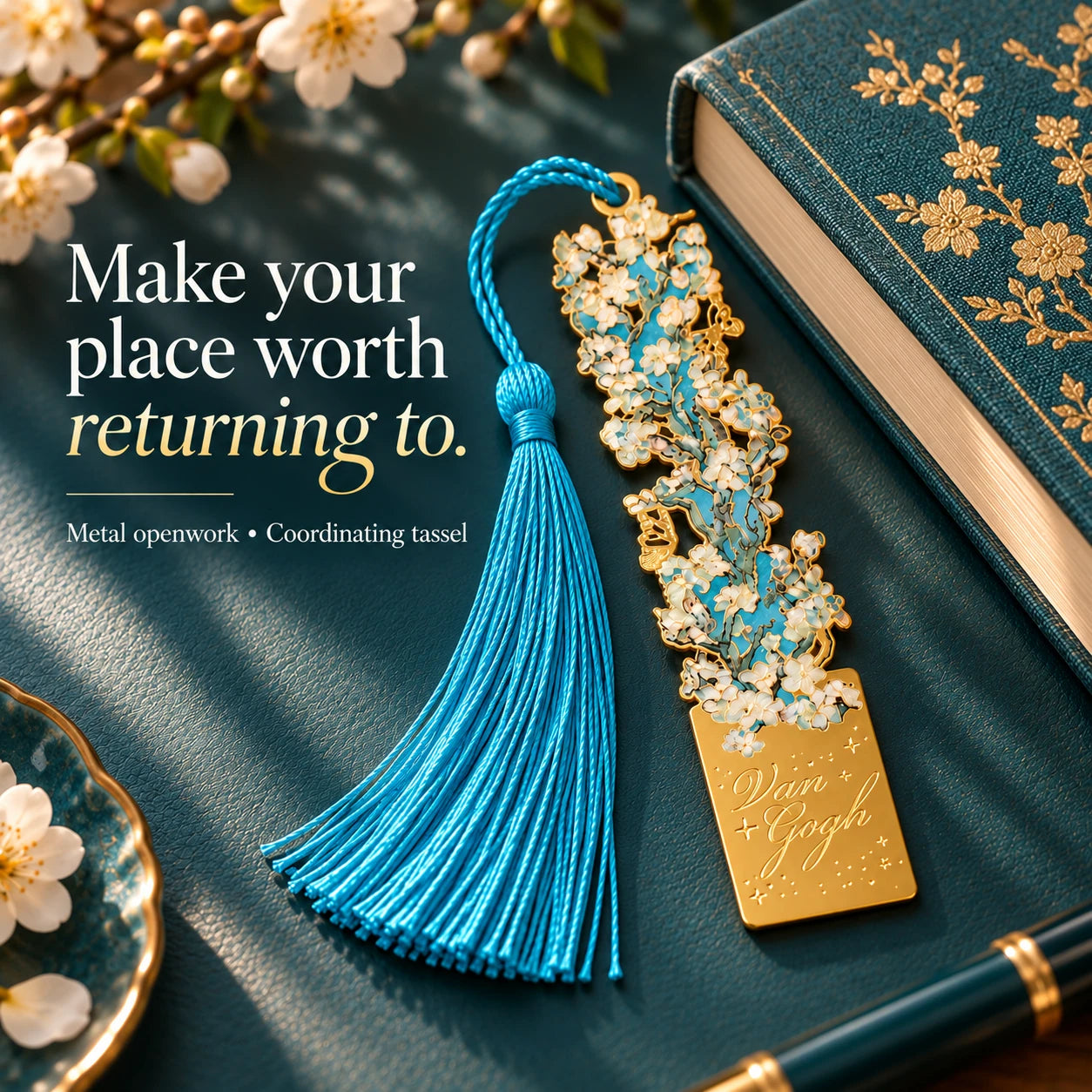 Gold-tone blossom openwork and a coordinating turquoise tassel in a reading setting.