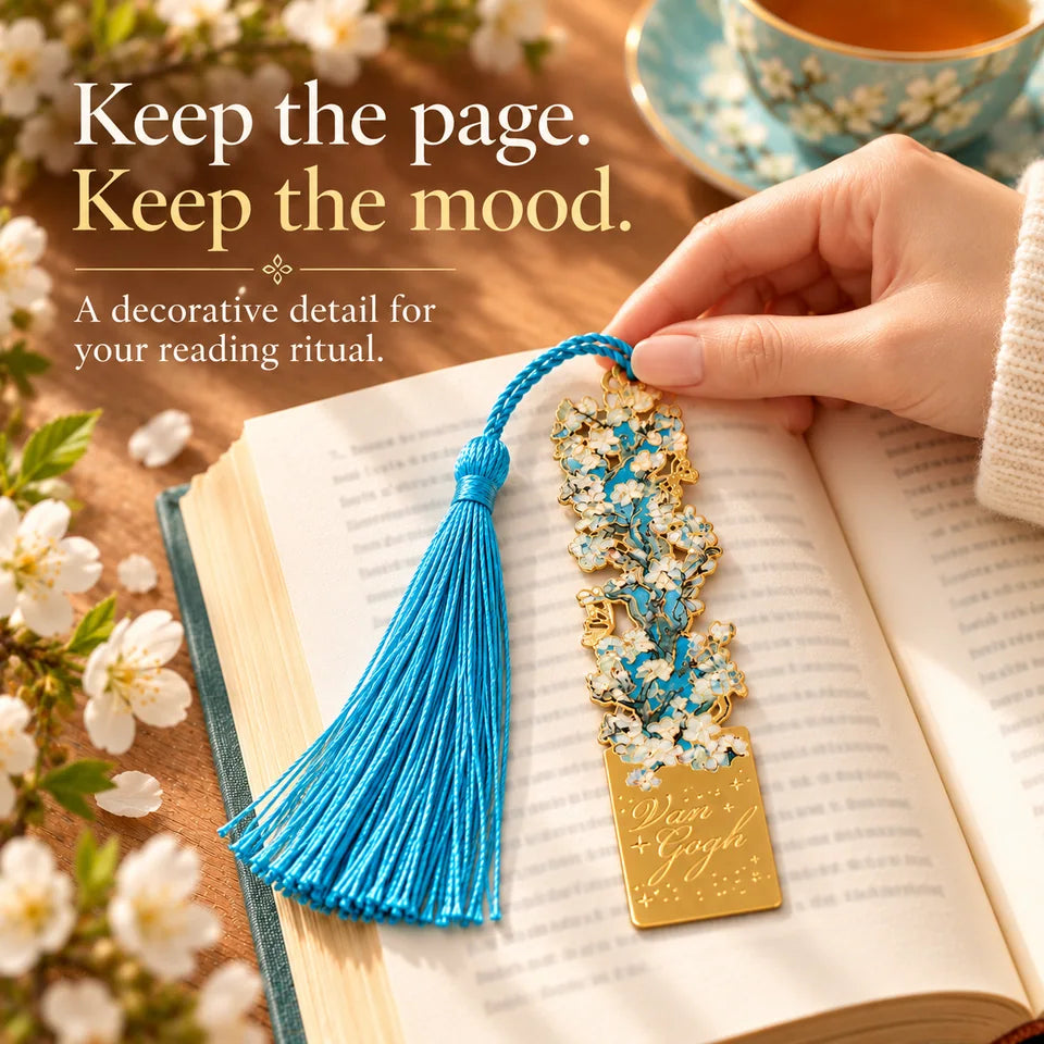 The blossom bookmark marking a pause in an open book.