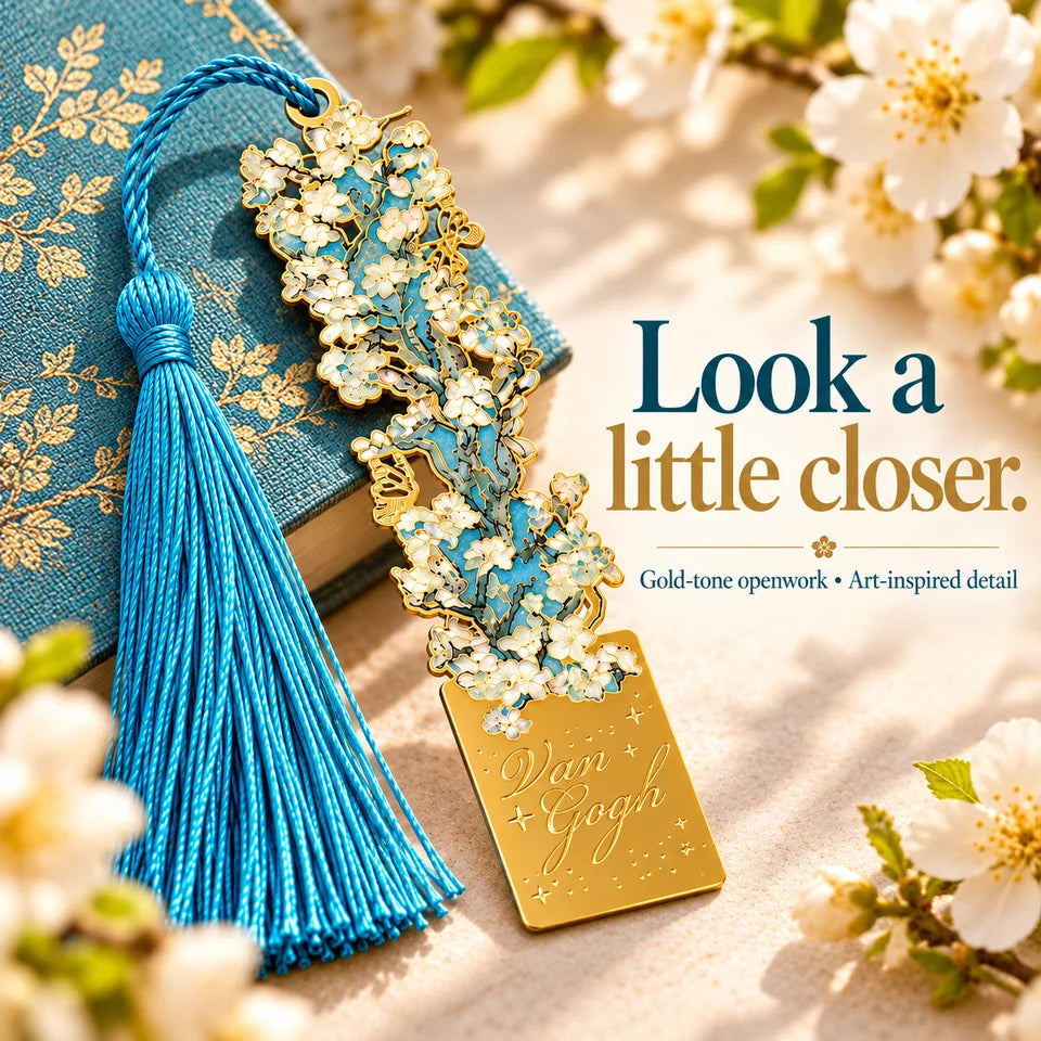 An enlarged view of pale floral openwork, gold-tone outlines and the turquoise tassel.